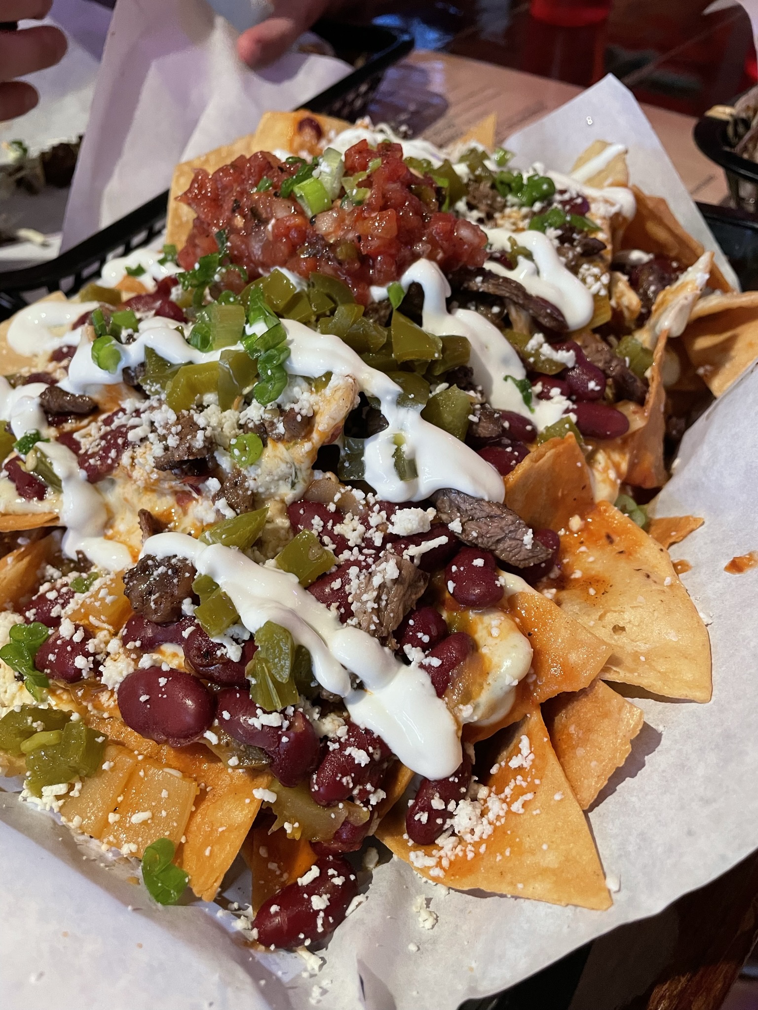 A richly topped plate photographed at Taqueria Outlaw