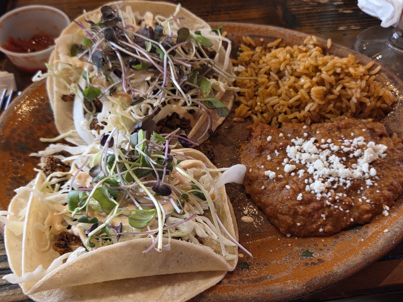 A taco plate photographed at Taqueria Outlaw